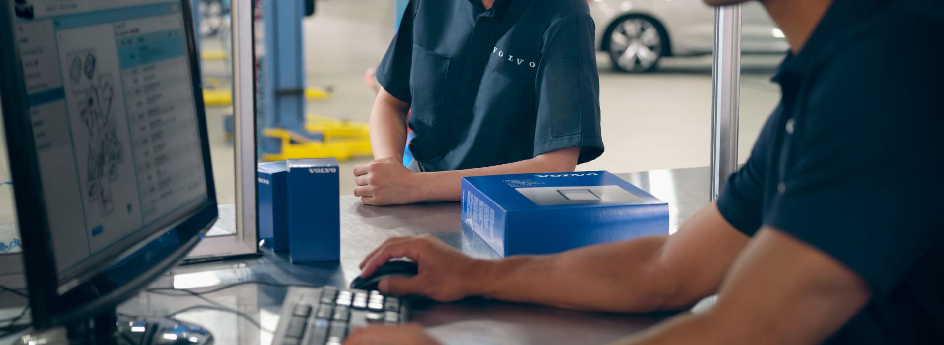 Volvo Collision Center technician using a computer