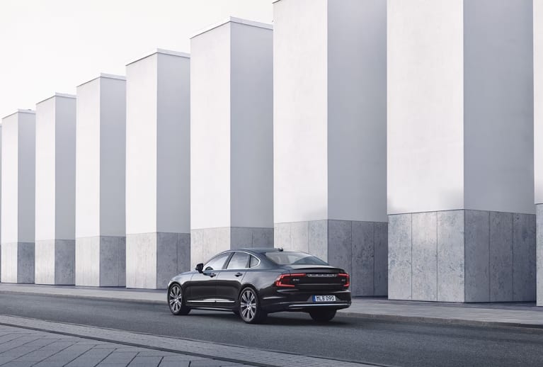 Volvo S90 driving on a city street