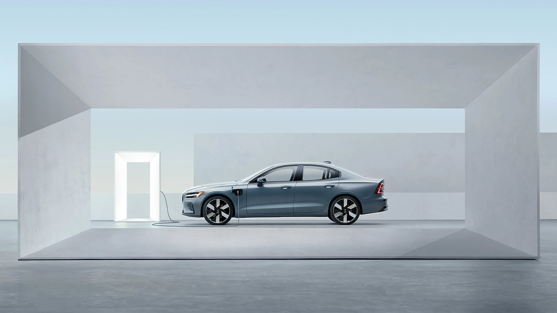 Volvo S60 charging among geometric shapes