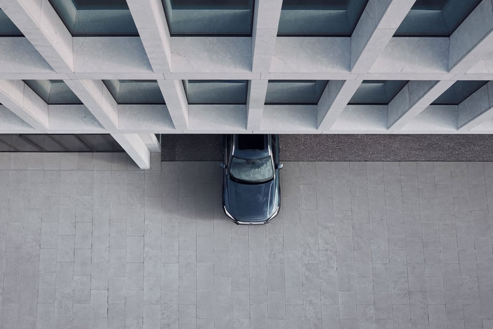overhead view of a Volvo driving out of a parking garage